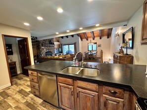 Open concept kitchen looking out to living/dining room