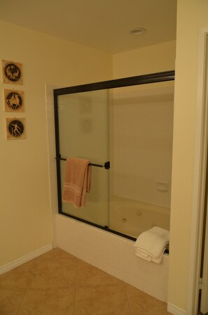 Primary jetted tub and shower.