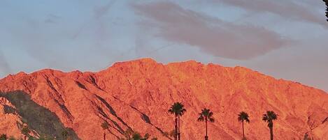 Sunrise from the patio, mountains are  ablaze with color. Perfect moments await.