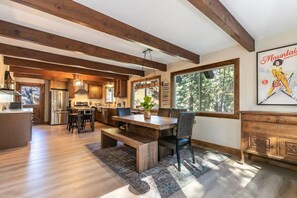 The open and spacious kitchen/dining area provides plenty of space for your group to cook together and eat meals as a group.