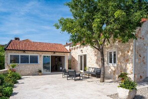 Villa Olim Civitas is a newly built luxury stone property in rustic, Dalmatian style
