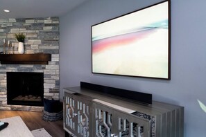 Living room TV with fireplace