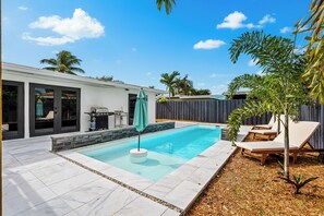 28-foot saltwater pool with beach area and sun loungers to soak up the sun