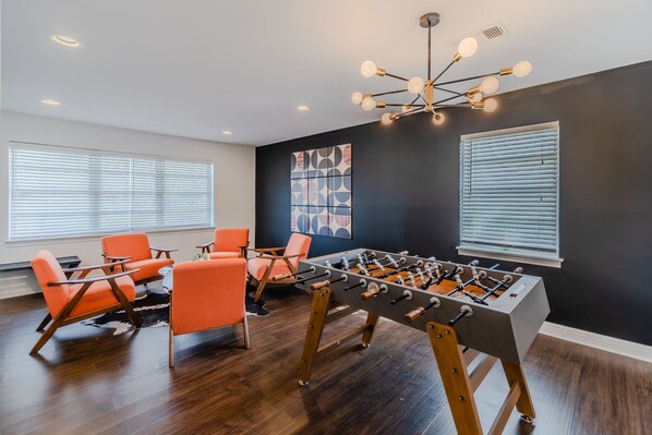 Foosball Fun with a Cozy Sitting Area to Unwind!