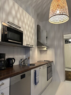 Micro wave, fridge- freezer, ceramic stove, oven, drip coffee maker, Nespresso
