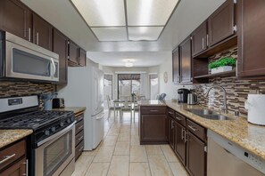 Fully equipped kitchen with all appliances, pots/pans, dishes, utensils, etc.