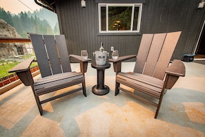 Outdoor deck with forest views, outdoor dining and lounging