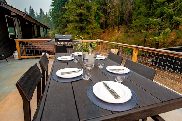 Please review listing description for more details about the property. Outdoor deck with forest views, BBQ, outdoor dining and lounging