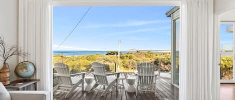 Views span the ocean’s horizon towards a backdrop of the Barwon Heads Bluff and beyond