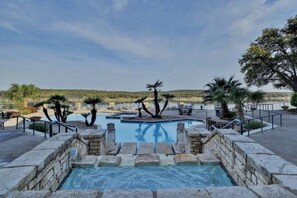 Relax at the hot tub and massive pool