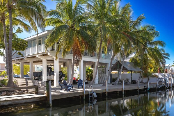 Enjoy the convenience of 70 feet of seawall, offering secure dockage for your boat and easy access to waterfront adventures right from your doorstep