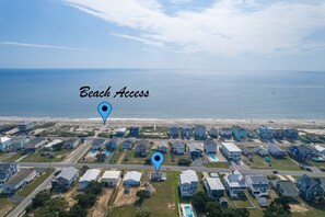 From Cottage By The Sea, it's Only a Brief 2 Block Walk & you'll have your Toes in the Sand.