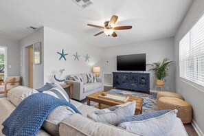 Living Room with Queen Size Sofa, Loveseat, and Smart TV