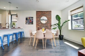 second level dining space includes table for 6 with the addition of breakfast bar w  seating for 4