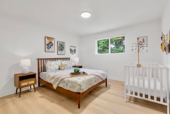 Here is the master bedroom with comfy bed and crib for baby