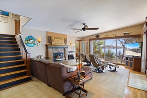 The main living area features lake views in all directions for a comfortable space to soak it all in.