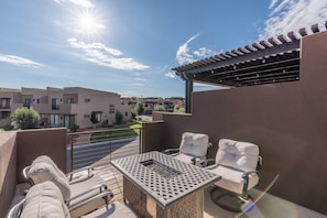 Patio Seating and Fire Pit - Stay warm next to the fire-pit and relax while watching the sunset over the red mountains.