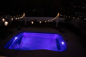 Private Pool / Fenced Backyard at Night Time