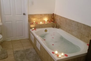 Romantic and relaxing jetted hot tub jacuzzi.