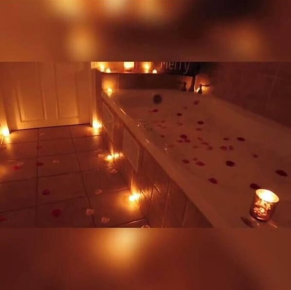 Perfect romantic scene. Rose petals included at no additional cost.