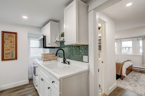 Kitchen with range and microwave to meet your cooking needs. 