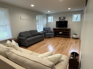 Spacious living room with queen pull-out couch,