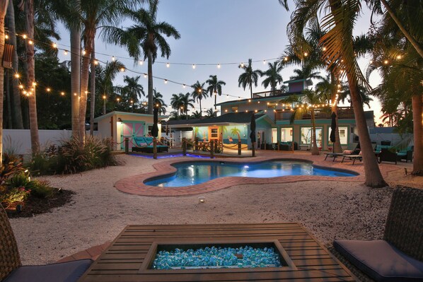 11 Palms - a SkyRun Anna Maria Property - Back yard - Relax in this gorgeous backyard with propane fire-pit to enjoy the night!