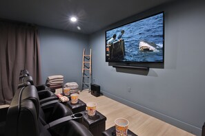 Movie Theatre - Enjoy a movie or the big game in this theatre setting, with an 85" OLED TV with full sonos surround sound!