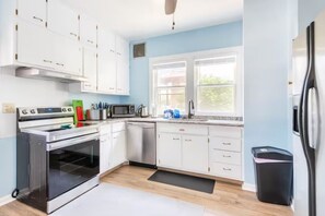 Fully equipped Kitchen, next to dinning room. New appliances,  granite counters.