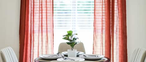 Dining Area - Enjoy your meals while looking at the birds visiting the trees in the backyard.