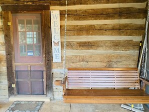Front door with porch swing from which you can enjoy the view of the valley.
