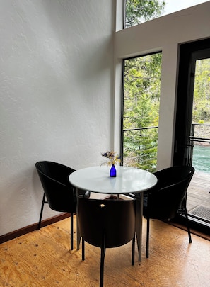 Mid century modern dining table overlooking the river.