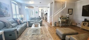 Spacious living area sits between the kitchen/dining area and a King bedroom