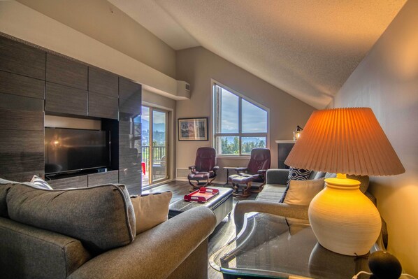 Enjoy the Luxurious entertainment room of this penthouse condo with stunning views of the lake.