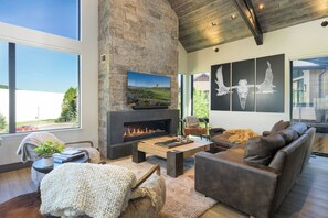 Relax and watch a movie or just hang by the fireplace in the main living room