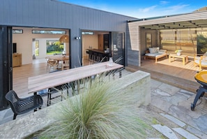 Outdoor dining & lounge area with BBQ