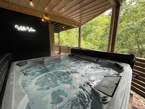 Enjoy the view soaking in the hot tub whether it be rain or shine! 