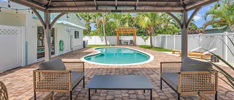 Cabana Covered Seating Area Overlooking the Pool in the Spacious Backyard