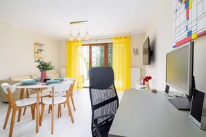 An open-plan space combining the living and dining areas, perfect for a comfortable stay.

