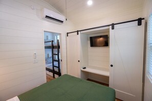 Queen bedroom closet and TV