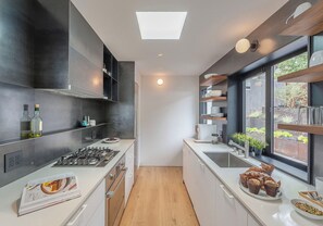 Fully-Equipped Kitchen with Sleek Finishes and Storage