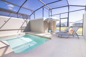 Enjoy a private heated pool with a BBQ grill and comfortable lounge chairs.