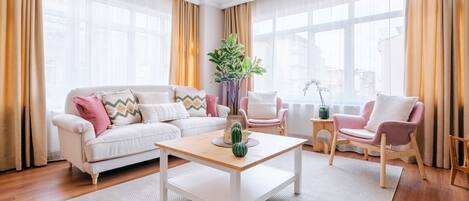 Stylish living room adorned with contemporary art and sleek furniture.