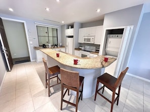 Enjoy a full kitchen with in-suite laundry and breakfast bar seating for 3.