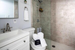 Spacious shower with complimentary body wash, shampoo, conditioner. Bath towels and makeup towels.