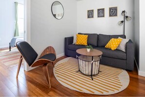Captivating space with a modern arm chair and queen sleeper sofa. Cozy and accommodates 4 people.