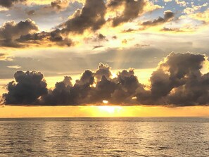 Sunset at the pier - Dolphins and manatees visit daily