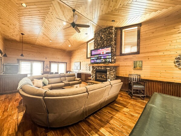 Main floor great room with pool table, game table, TV and Arcade