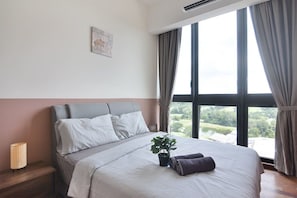 The master bedroom with a queen-sized bed.