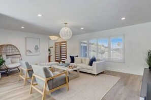 Front living room with fireplace and tv